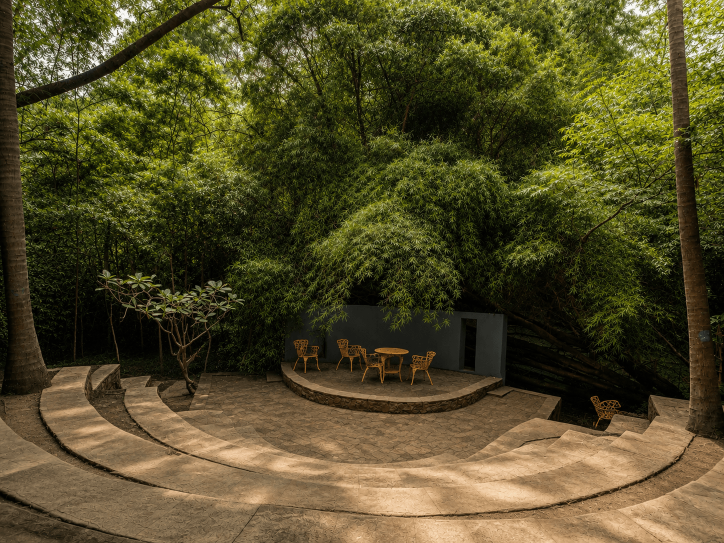 Amphitheatre lawn bowl with stone tiers and stage in natural grove